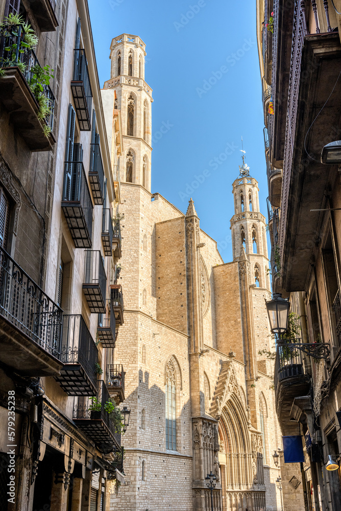 The iconic Santa Maria del Mar church in Barcelona seen through a small alleyway