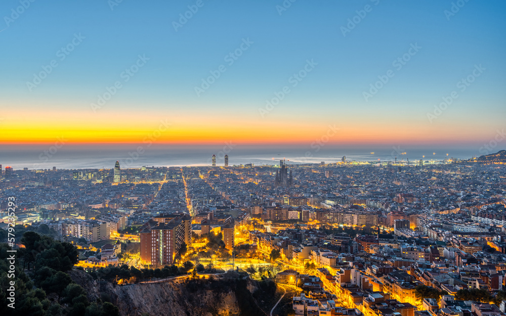 The skyline of Barcelona with the Mediterranean Sea before sunrise