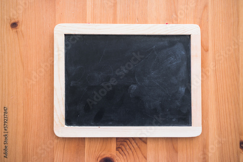 small blackboard with blank copy space on top of wooden table