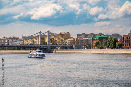 Krymsky Bridge or Crimean Bridge in Moscow and Cruise ship sails on the Moscow river