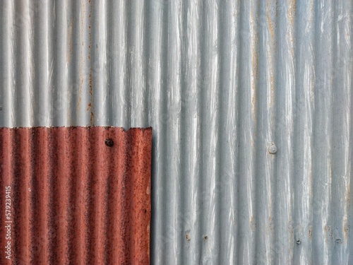 Closeup old and rusty corrugated zinc sheet wall  grunge background metal texture