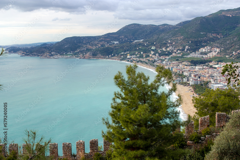Fototapeta premium Top view of the bay area, old city, fortress, sea and mountains in Alanya, Turkey