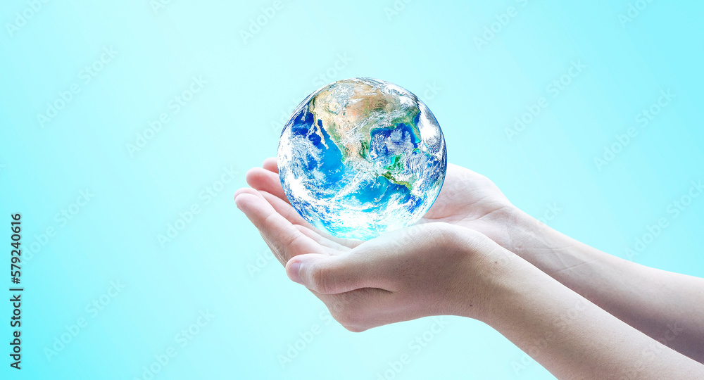 Hand holding blue planet earth globe with blurred background . Elements of this image furnished by NASA. Hand holding blue planet earth globe with blurred background . Elements of this image furnished by NASA.