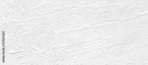White concrete wall background in vintage style for graphic design or wallpaper. Pattern of soft cement floor in retro concept. Gray abstract texture detail in construction.