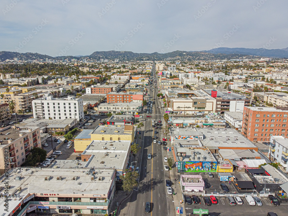 Los Angeles, California – February 17, 2023: aerial city view drone photo toward North Western Ave in Korea town LA showing Korean shops, apartments, homes, streets, buildings