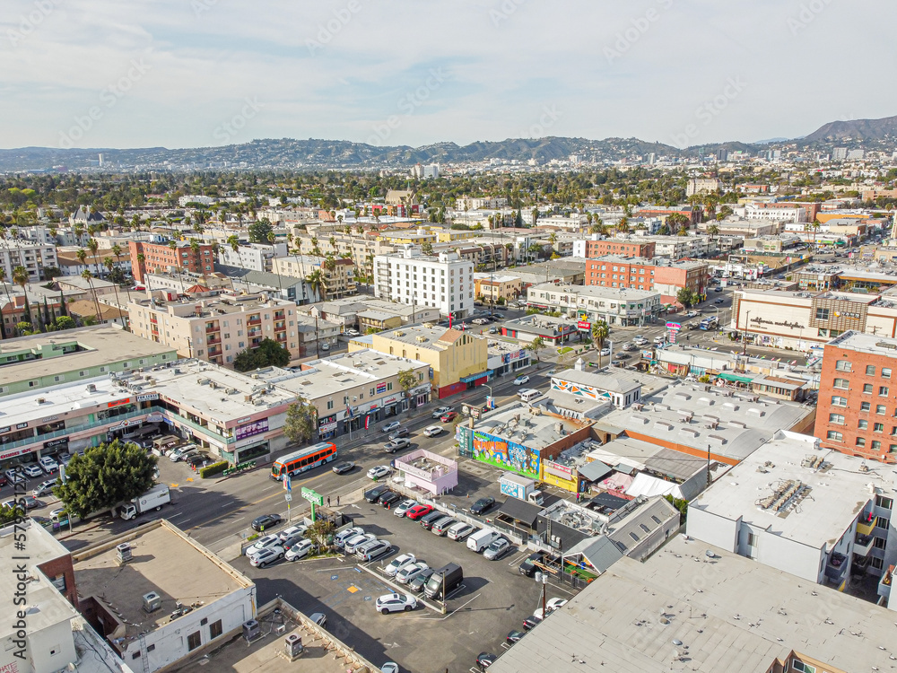 Los Angeles, California – February 17, 2023: aerial city view drone photo toward North Western Ave in Korea town LA showing Korean shops, apartments, homes, streets, buildings