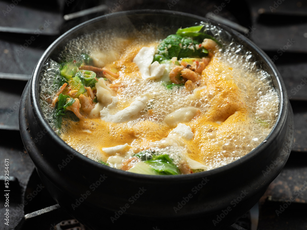 Stew boiling in an earthenware pot