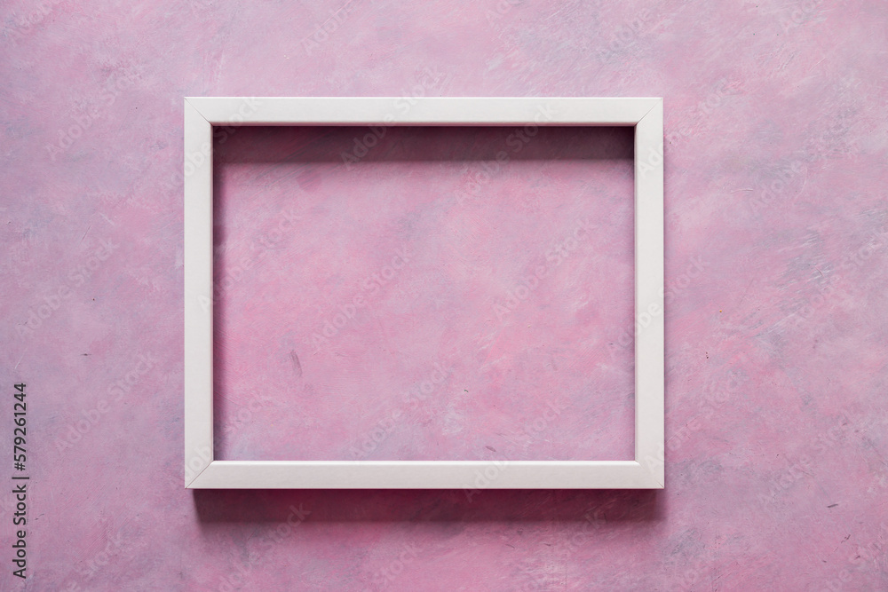 Fototapeta premium white rectangular picture frame mock-up with copy space for yout text or image on top of pink background