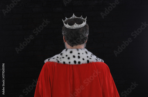 medieval king back on black background