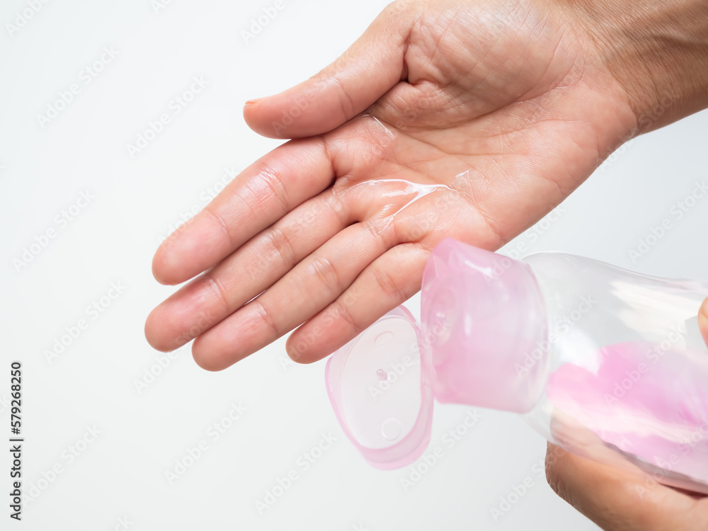 Baby Oil on Palm on White Background,Woman Pour Massage on Hand for Apply Body and Face after Shower in Bathroom at Home for Nourishes Skin to be Soft and Moisturized,Cosmetic for Beauty and Health. Baby Oil on Palm on White Background,Woman Pour Massage on Hand for Apply Body and Face after Shower in Bathroom at Home for Nourishes Skin to be Soft and Moisturized,Cosmetic for Beauty and Health.