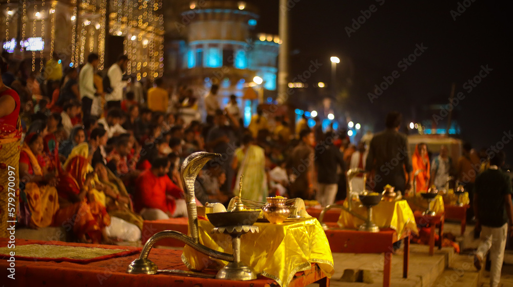 VARANASI, INDIA- 22 FEB 2023 : A Hindu priest performs the Ganga Aarti ritual in Varanasi. Fire puja is a Hindu ritual that takes place at Dashashwamedh Ghat on the banks of the river Ganges.
