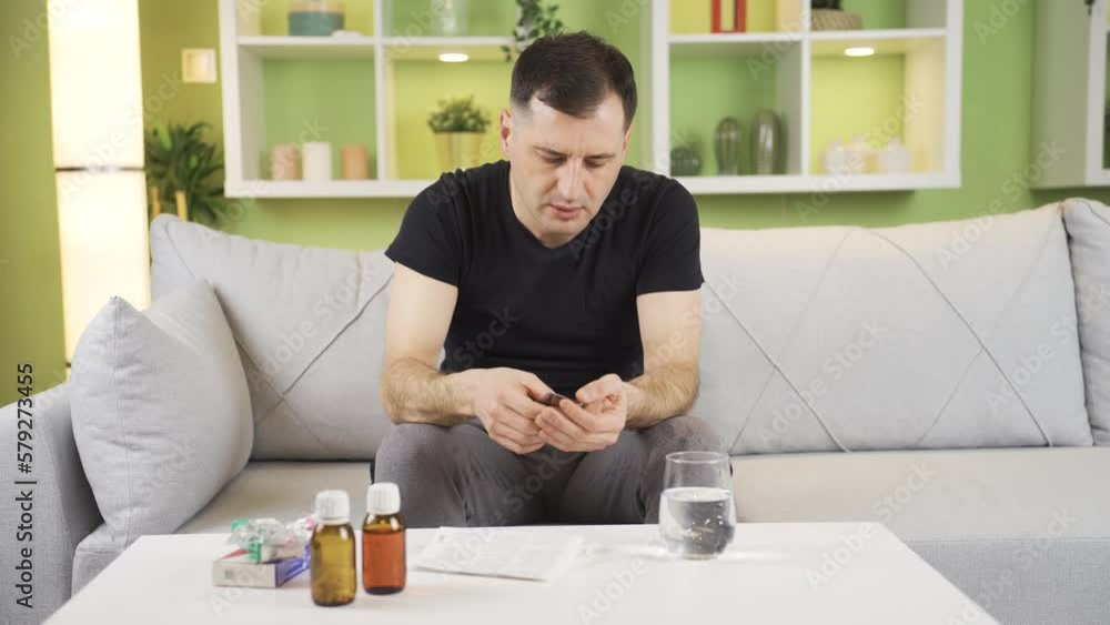 Hand tremor is severe and intense man drinks medication.
The man with trembling hands is using medication for precaution.
Hand tremor is severe and intense man drinks medication.
The man with trembling hands is using medication for precaution.