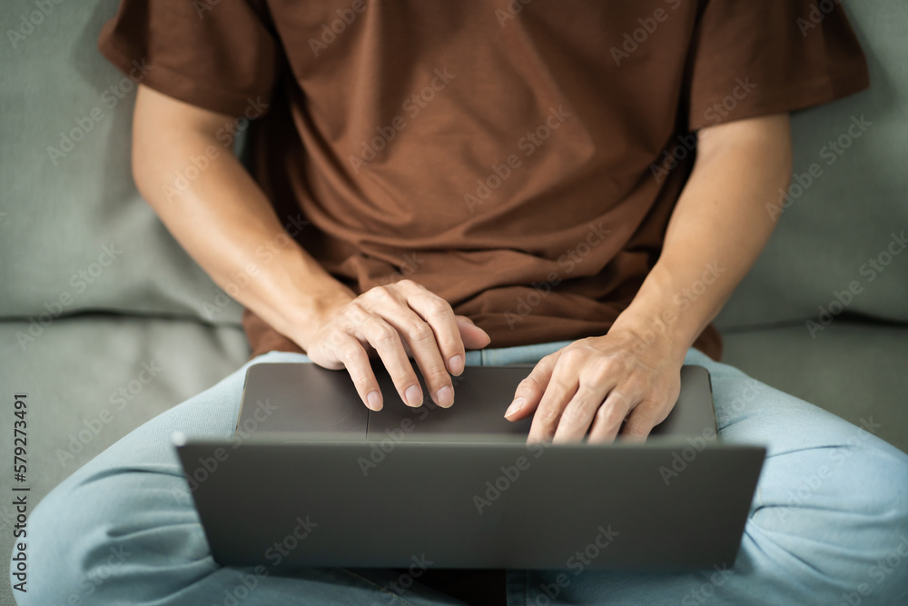 Fototapeta premium Man work from home. work online on laptop. Asian businessman working online business concept with social distancing laptop online meeting.