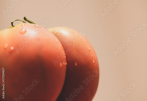 Red Tomato similar in ass,butt women.Concept Female organs isolated