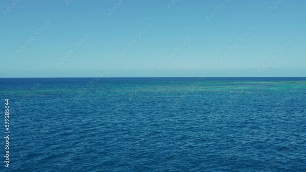 Calm water at the Great Barrier Reef in the Coral Sea. Seaside ocean with clear turquoise blue sea in South Pacific Queensland Australia off the coast of Cairns. Seven Natural Wonders of the World 4K Calm water at the Great Barrier Reef in the Coral Sea. Seaside ocean with clear turquoise blue sea in South Pacific Queensland Australia off the coast of Cairns. Seven Natural Wonders of the World 4K