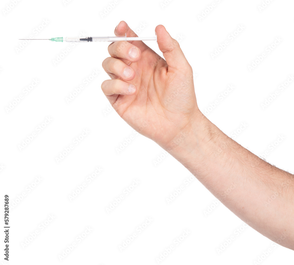 New syringe in adult hand on white background New syringe in adult hand on white background