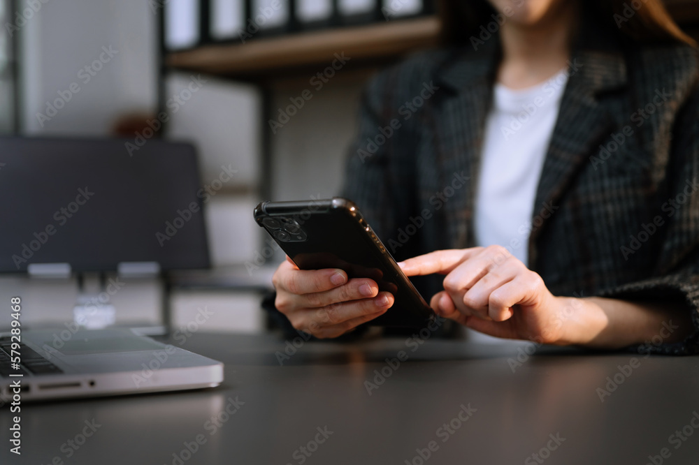 businesswoman hand using smart phone, tablet payments and holding credit card online shopping, omni channel, digital tablet docking keyboard computer at office . businesswoman hand using smart phone, tablet payments and holding credit card online shopping, omni channel, digital tablet docking keyboard computer at office .