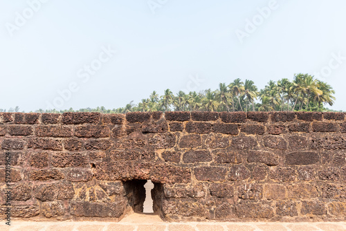 The laterite brick wall of the ancient Portuguese era Fort Aguada in Sinquerim in North Goa. photo