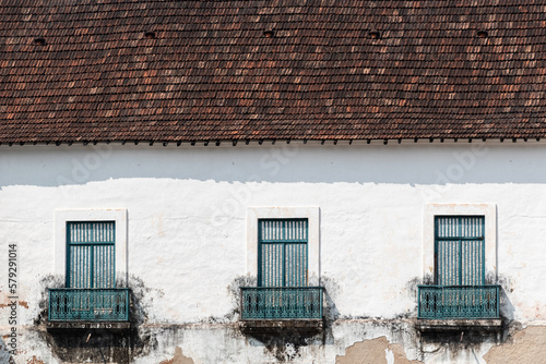 Vintage windows on the exterior facade of the historic St. Francis Xavier church in Old Goa. photo