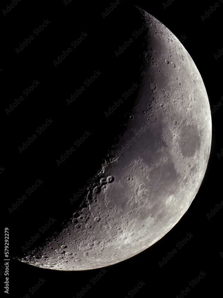 A large photograph of the moon taken through a telescope. Moon with craters on a dark background. - obrazy, fototapety, plakaty 