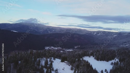 Aerial view of a winter rural hilly landscape in the Carpathian frorest.  photo