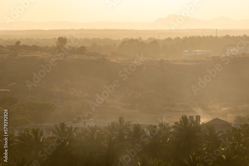 Hazy landscape of the rural countryside around the village of Sravanabelagola in Karnataka. photo