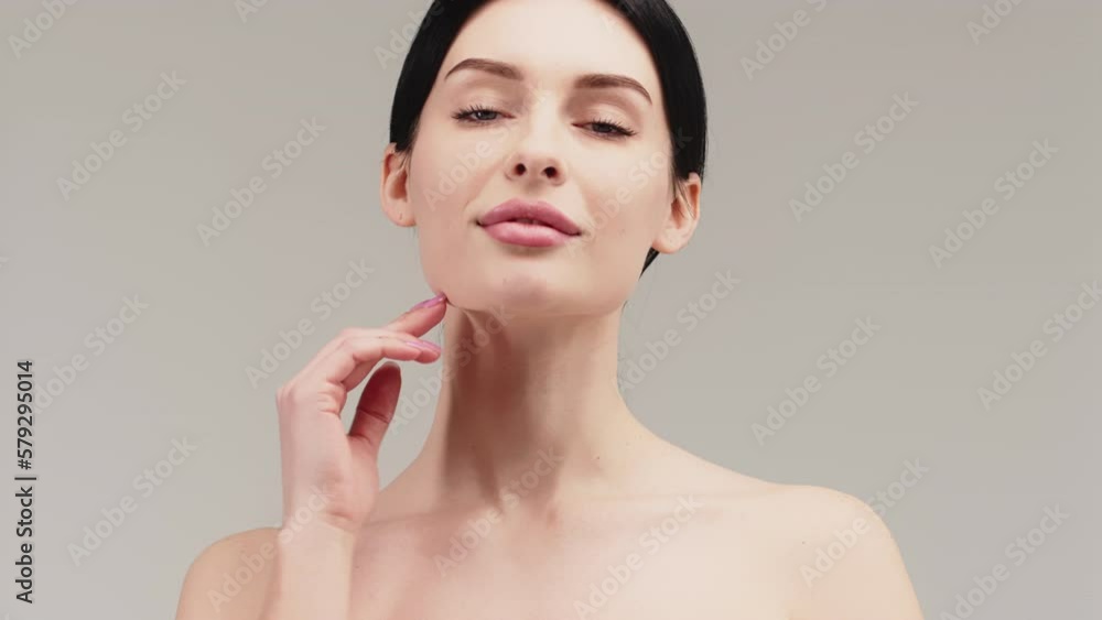 Beauty woman face with blue eyes looking at camera, isolated on white background. Beautiful female model with perfect clean fresh skin. Skin care treatment or cosmetic ads concept Beauty woman face with blue eyes looking at camera, isolated on white background. Beautiful female model with perfect clean fresh skin. Skin care treatment or cosmetic ads concept