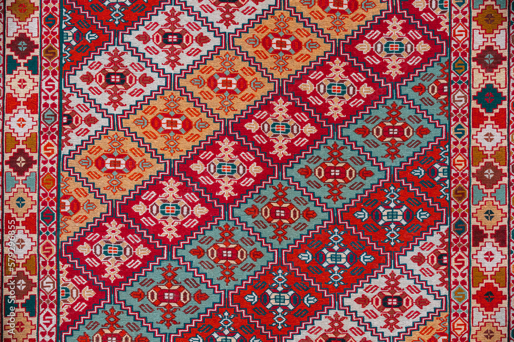 Carpet Texture, Abstract Ornament. Colorful Oriental Mosaic Carpet With Traditional Ornament. Patterned Carpet. Closeup View Of Handmade Woven Carpet.