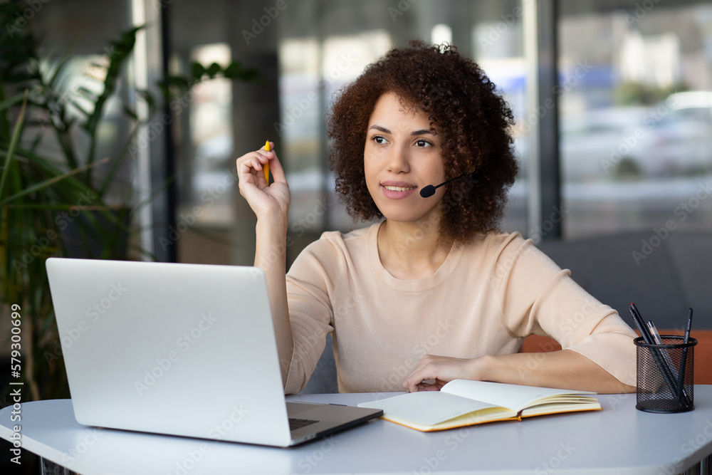 Portrait of african american curly haired customer service woman working on call center Portrait of african american curly haired customer service woman working on call center