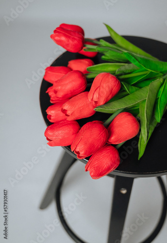 a bouquet of red tulips on a white background