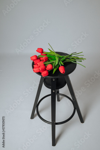 a bouquet of red tulips on a white background
