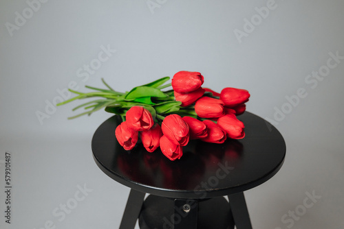 a bouquet of red tulips on a white background