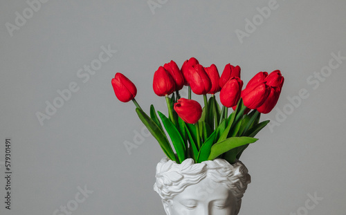a bouquet of red tulips on a white background