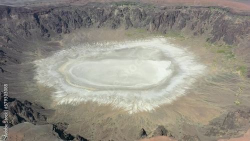 This place is called the Al Wabah (Maqla Tamia in Arabic). It is a volcanic crater located on the western edge of the Hafer Kishb basaltic plateau that contains many volcanic cones. photo