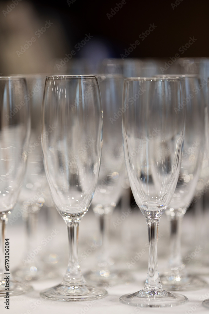 Empty clean champagne glasses in rows Empty clean champagne glasses in rows