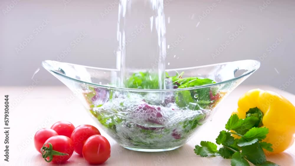 pour water and wash vegetables greens cooking delicious healthy food