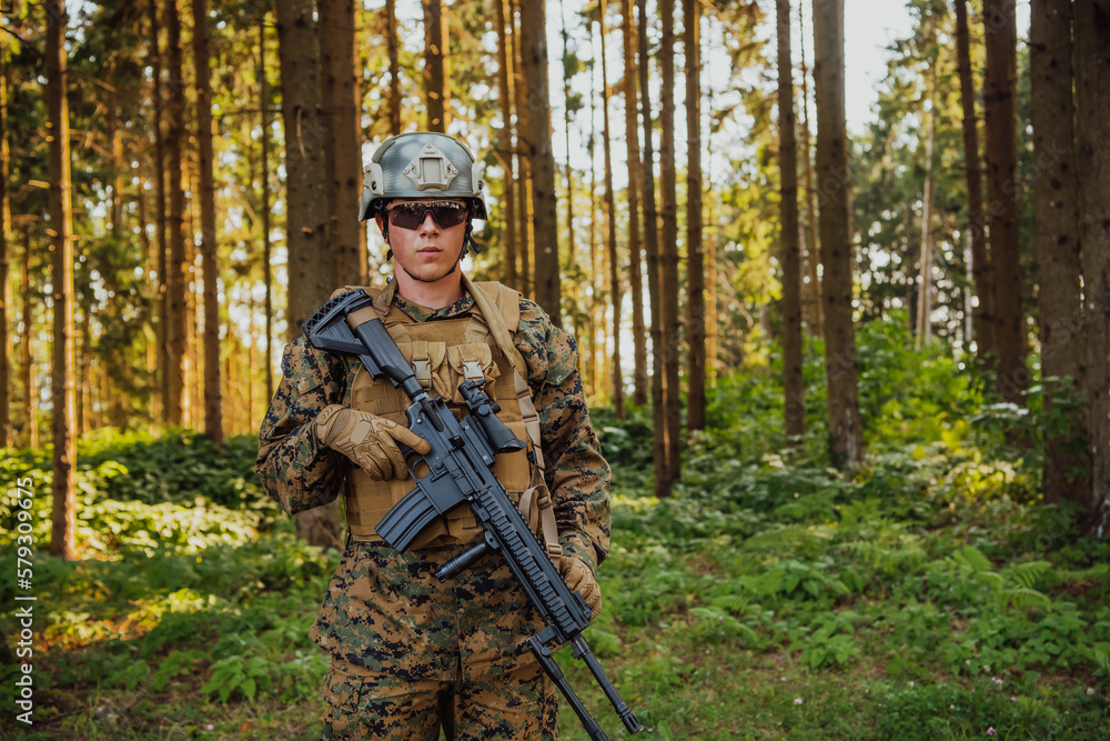 A modern warfare soldier on war duty in dense and dangerous forest areas. Dangerous military rescue operations A modern warfare soldier on war duty in dense and dangerous forest areas. Dangerous military rescue operations