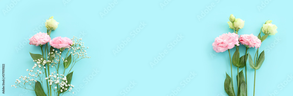 Top view image of delicate lisianthus flowers over pastel blue background Top view image of delicate lisianthus flowers over pastel blue background