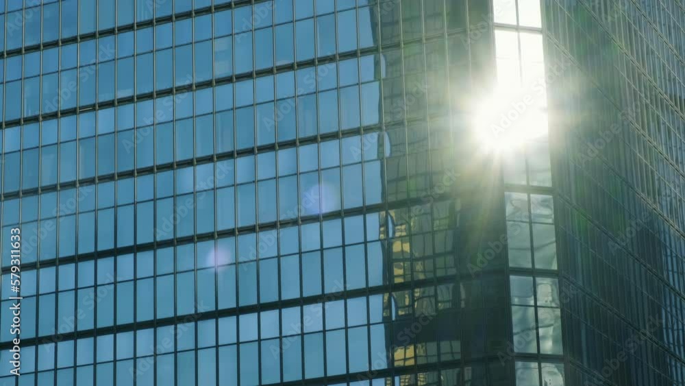 Modern business architecture with glass and steel walls reflecting the