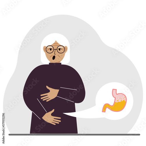The concept of pain in the abdomen. The old woman holds his stomach with both hands. Problems with the stomach or digestion.
