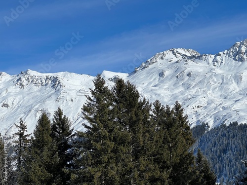 Beautiful sunlit and snow-capped alpine peaks above the Swiss tourist sports-recreational winter resorts of Valbella and Lenzerheide in the Swiss Alps - Canton of Grisons, Switzerland (Schweiz) © Mario