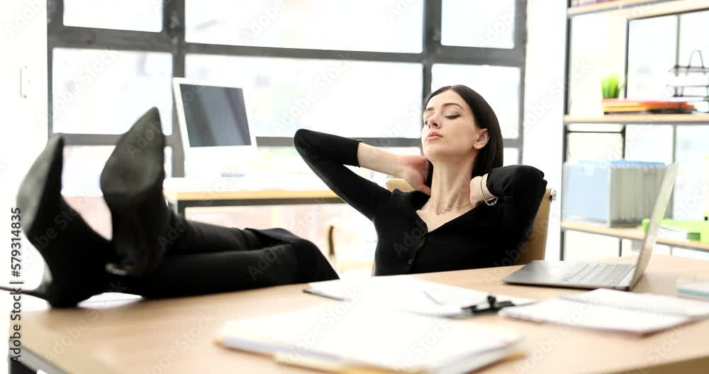 Tired businesswoman resting at work with her feet on table 4k movie slow motion Tired businesswoman resting at work with her feet on table 4k movie slow motion
