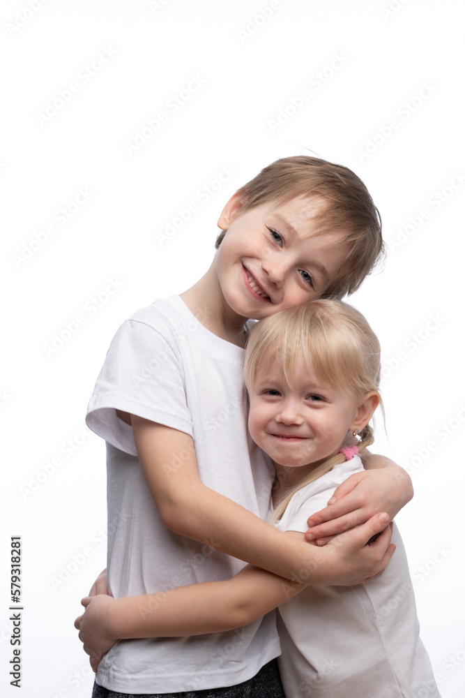 Portrait of a child, the love of brother and sister in his arms on a white background Portrait of a child, the love of brother and sister in his arms on a white background