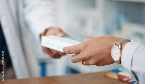 Closeup, hands and prescription with customer, pharmacist and medicine in drug store. Zoom, hand and medication in clinic, pills and pharmacy for medical antibiotics product, healthcare and wellness