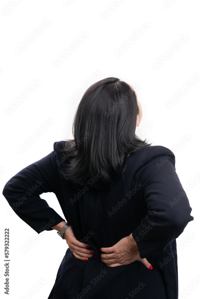 Adult businesswoman touching painful back as sedentarism concept Adult businesswoman touching painful back as sedentarism concept