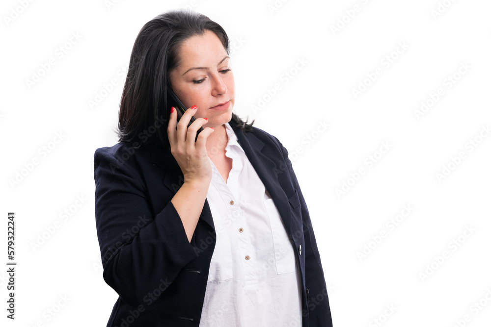 Corporate adult woman with serious expression talking on phone Corporate adult woman with serious expression talking on phone
