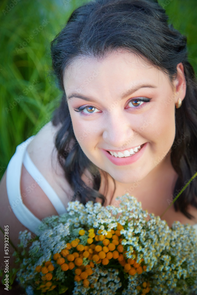 Portrait of Slavic plump chubby girl on the feast of Ivan Kupala with flowers on a summer evening Portrait of Slavic plump chubby girl on the feast of Ivan Kupala with flowers on a summer evening