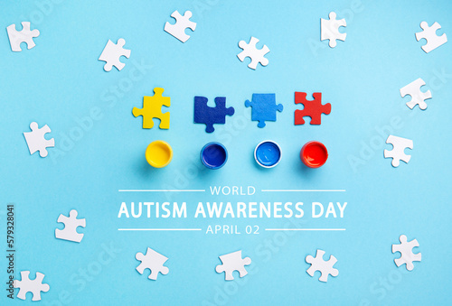 World Autism Awareness Day Card, colorful Puzzles on Blue Background.