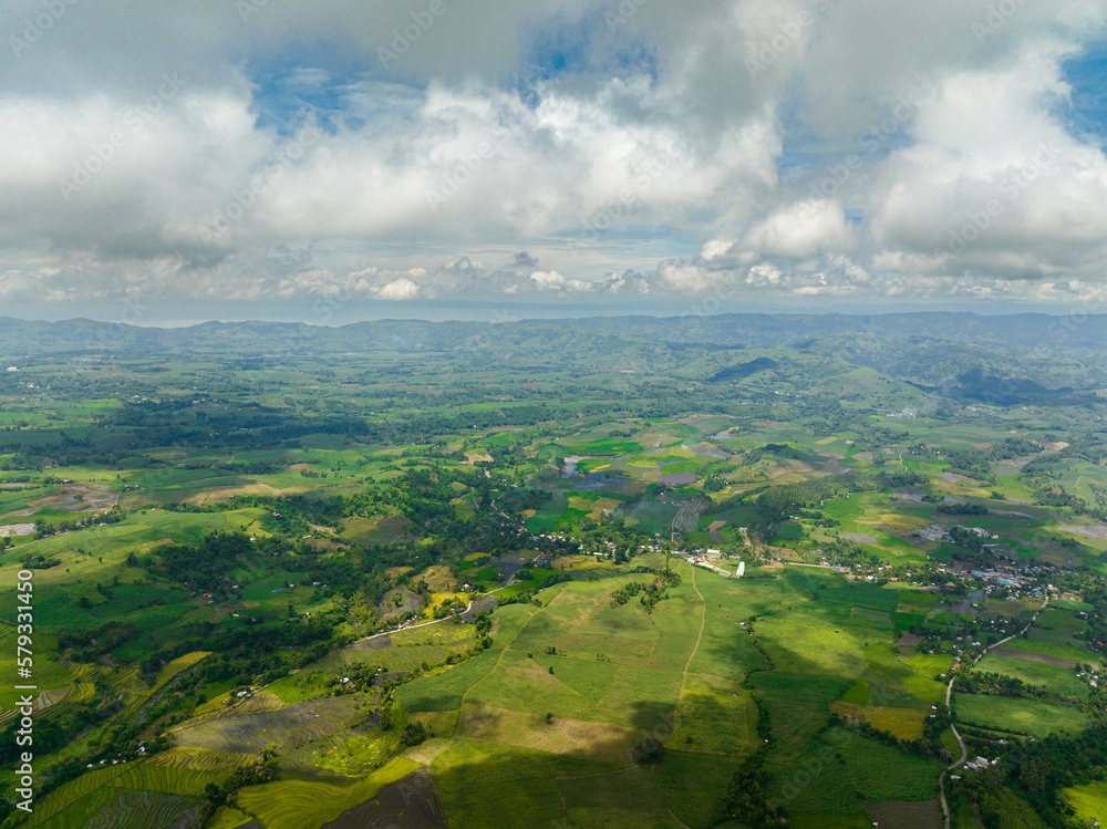 Aerial drone of rice plantations and farmland of farmers in a mountain valley. Negros, Philippines