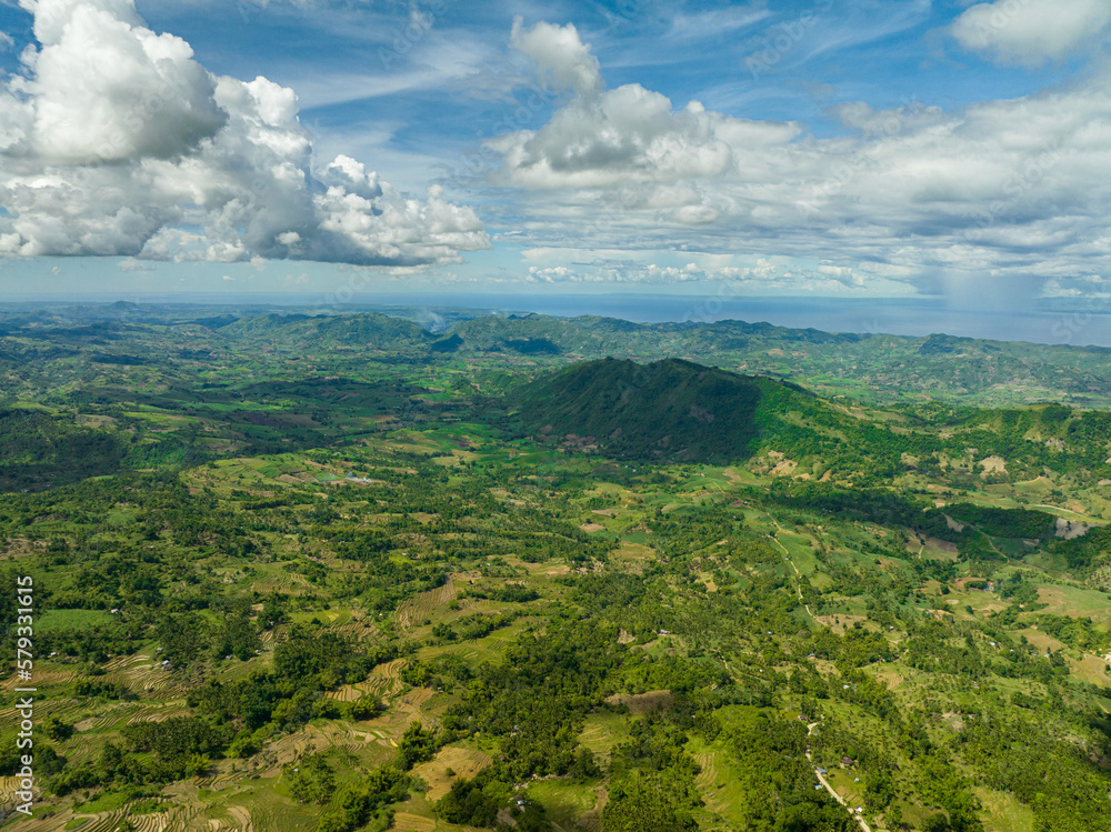 Aerial view of farmland on the slopes of hills in the mountainous region. Negros, Philippines